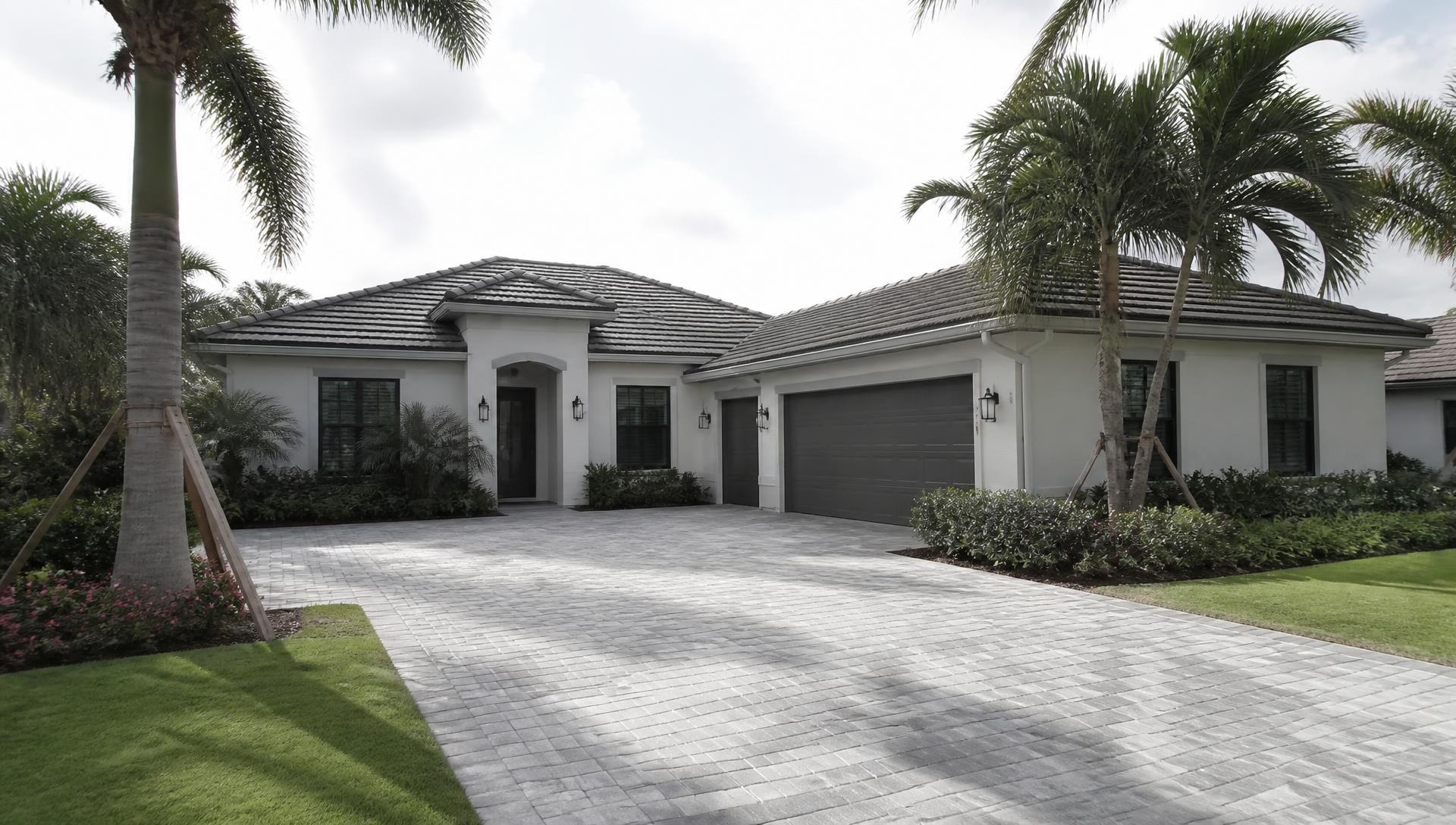 Welcoming Florida home with a landscaped entry and driveway